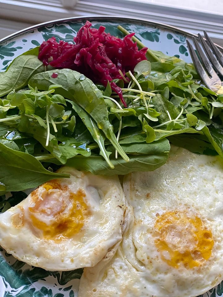 Eggs with greens on a plate