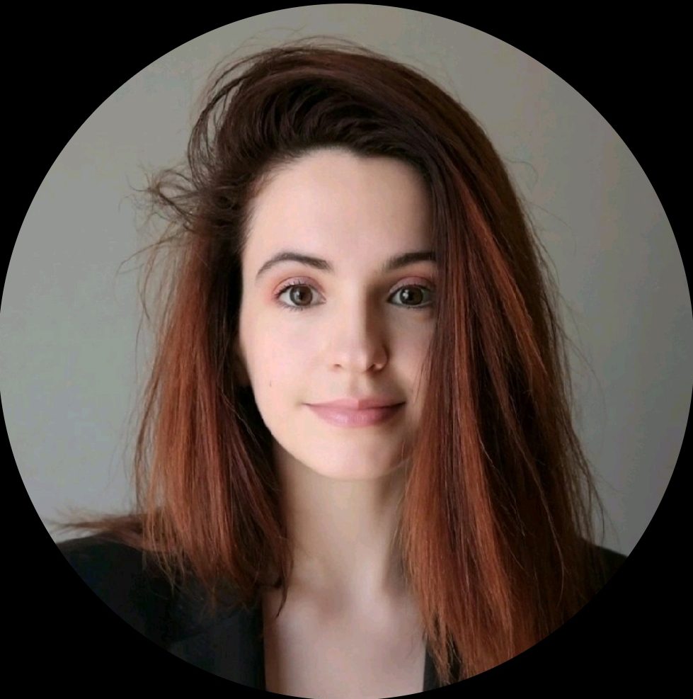 Headshot of young woman with straight black red hair